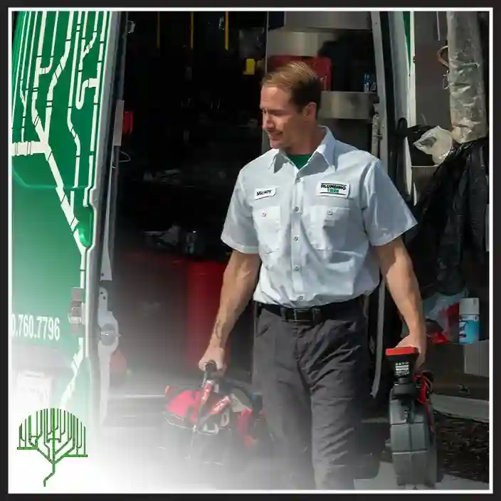 Plumbing Tree technician retrieving a red Milwaukee tool case from a service van shelf